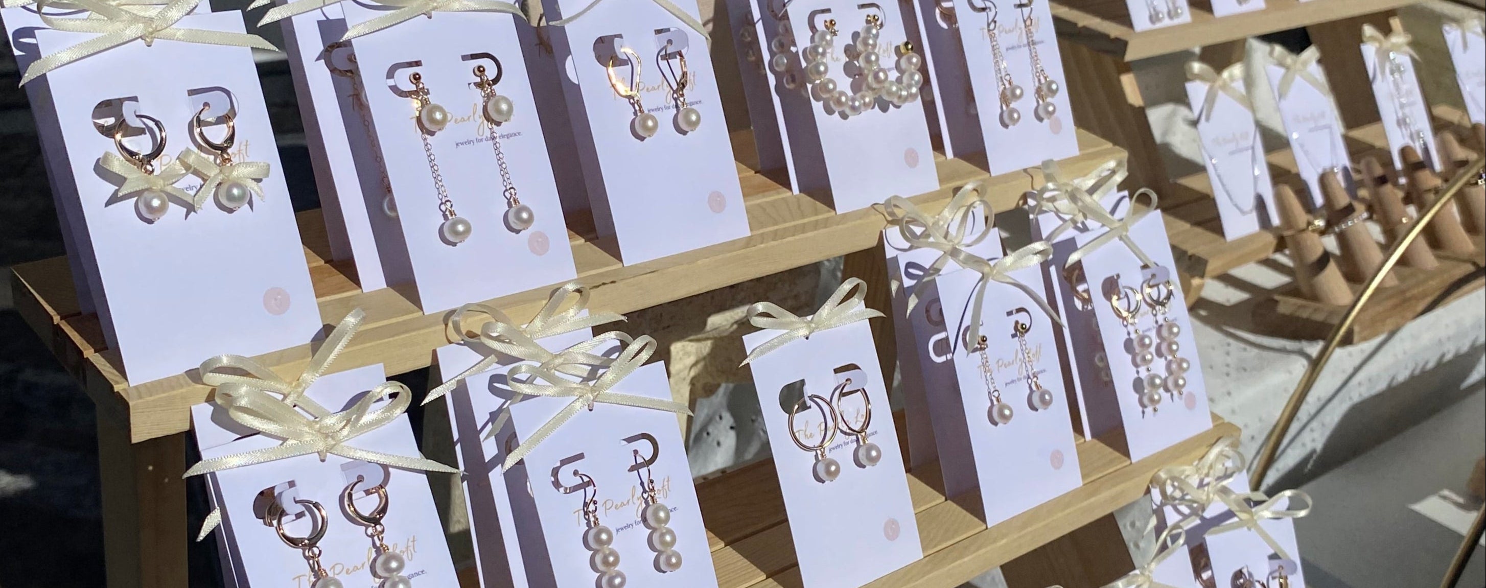 Jewelry display with cards on a stand